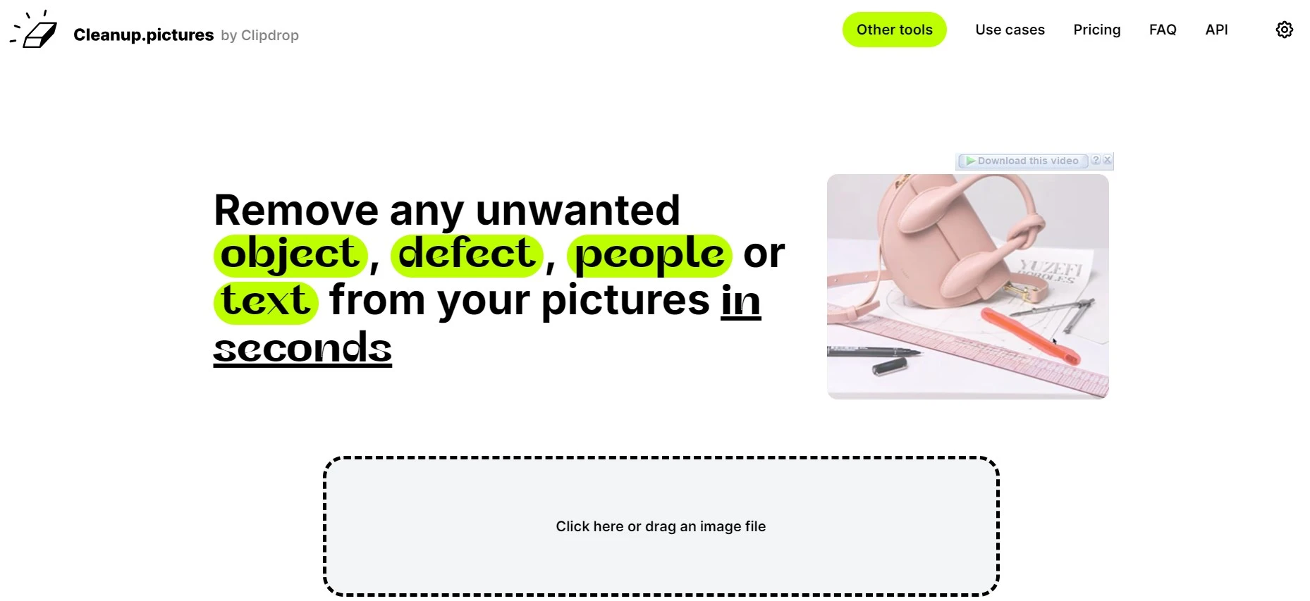Screenshot of the Cleanup.pictures website homepage featuring a headline that reads 'Remove any unwanted object, defect, people or text from your pictures in seconds' with a demonstration video on the right side showing the removal of an object from an image
